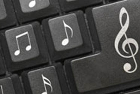 Close up of a computer keyboard - letters have been replaced with musical symbols