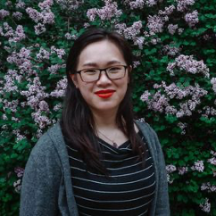 Cynthia Liu headshot - Cynthia standing in front of some purple flowers